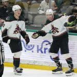 
              Arizona Coyotes center Travis Boyd (72) celebrates his overtime goal with Barrett Hayton (29) during an NHL hockey game against the Dallas Stars in Dallas, Wednesday, April 27, 2022. The Coyotes won 4-3. (AP Photo/LM Otero)
            