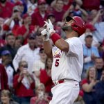 
              St. Louis Cardinals' Albert Pujols celebrates after hitting a solo home run during the first inning of a baseball game against the Kansas City Royals Tuesday, April 12, 2022, in St. Louis. (AP Photo/Jeff Roberson)
            