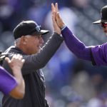 
              Colorado Rockies manager Bud Black, left, congratulates first baseman Connor Joe after the ninth inning of a baseball game against the Los Angeles Dodgers Sunday, April 10, 2022, in Denver. (AP Photo/David Zalubowski)
            