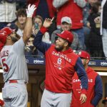 
              St. Louis Cardinals' Albert Pujols (5) reacts with Yadier Molina, right, after hitting a three-run home run against the Milwaukee Brewers during the third inning of a baseball game, Sunday, April 17, 2022, in Milwaukee. (AP Photo/Jeffrey Phelps)
            