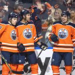 
              Edmonton Oilers defenceman Darnell Nurse (25) celebrates his goal against the St. Louis Blues with Leon Draisaitl (29) and Cody Ceci (5) during the second period of an NHL hockey game Friday, April 1, 2022, in Edmonton, Alberta. (Jason Franson/The Canadian Press via AP)
            