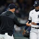 
              New York Yankees relief pitcher Aroldis Chapman, right, hands the ball to manager Aaron Boone as he leaves during the ninth inning of a baseball game against the Toronto Blue Jays, Thursday, April 14, 2022, in New York. (AP Photo/Frank Franklin II)
            