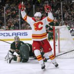
              Calgary Flames left wing Johnny Gaudreau celebrates his goal on Minnesota Wild goalie Cam Talbot during the second period of an NHL hockey game Thursday, April 28, 2022, in St. Paul, Minn. (AP Photo/Craig Lassig)
            