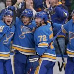
              St. Louis Blues' Brayden Schenn is congratulated by teammates Ivan Barbashev, left, Justin Faulk (72) and Pavel Buchnevich (89) after scoring the game-winning goal in overtime of an NHL hockey game against the Minnesota Wild Saturday, April 16, 2022, in St. Louis. (AP Photo/Jeff Roberson)
            