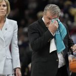 
              UConn head coach Geno Auriemma wipes his eyes during the first half of a college basketball game in the final round of the Women's Final Four NCAA tournament Sunday, April 3, 2022, in Minneapolis. (AP Photo/Eric Gay)
            
