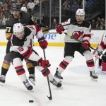 
              New Jersey Devils center Dawson Mercer (18) gathers the puck against Vegas Golden Knights left wing Max Pacioretty (67) during the second period of an NHL hockey game Monday, April 18, 2022, in Las Vegas. (AP Photo/Joe Buglewicz)
            