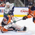 
              Vancouver Canucks' Alex Chiasson (39) looks for a rebound as Edmonton Oilers goalie Mikko Koskinen (19) makes a save and Duncan Keith (2) defends during the first period of an NHL hockey game Friday, April 29, 2022, in Edmonton, Alberta. (Jason Franson/The Canadian Press via AP)
            