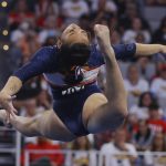 
              Auburn's Sunisa Lee competes in the floor exercise during the NCAA college women's gymnastics championships, Saturday, April 16, 2022, in Fort Worth, Texas. (AP Photo/Gareth Patterson)
            