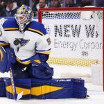 
              St. Louis Blues goaltender Jordan Binnington (50) makes a save during the first period of an NHL hockey game against the Buffalo Sabres, Thursday, April 14, 2022, in Buffalo, N.Y. (AP Photo/Jeffrey T. Barnes)
            