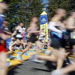 
              Runners cross the starting line of the 126th Boston Marathon, Monday, April 18, 2022, in Hopkinton, Mass. (AP Photo/Mary Schwalm)
            