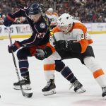 
              Columbus Blue Jackets' Brendan Gaunce, left, and Philadelphia Flyers' Patrick Brown fight for a loose puck during the second period of an NHL hockey game Thursday, April 7, 2022, in Columbus, Ohio. (AP Photo/Jay LaPrete)
            