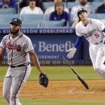 
              Atlanta Braves relief pitcher Kenley Jansen, left, watches as Los Angeles Dodgers' Freddie Freeman pops out to end the baseball game Tuesday, April 19, 2022, in Los Angeles. (AP Photo/Mark J. Terrill)
            