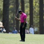 
              Tiger Woods reacts to his approach shot on the eighth fairway during the first round at the Masters golf tournament on Thursday, April 7, 2022, in Augusta, Ga. (AP Photo/Charlie Riedel)
            