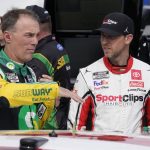 
              Denny Hamlin, right, talks with Kevin Harvick prior to practice for Saturday's NASCAR Cup Series auto race at the Martinsville Speedway Friday April 8, 2022, in Martinsville, Va. (AP Photo/Steve Helber)
            