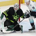 
              Dallas Stars goaltender Jake Oettinger (29) defends the goal against Seattle Kraken center Ryan Donato (9) during the second period of an NHL hockey game in Dallas, Saturday, April 23, 2022. (AP Photo/LM Otero)
            