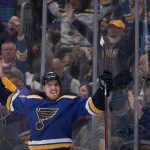 
              St. Louis Blues' Robert Thomas celebrates after scoring the game-winning goal in overtime of an NHL hockey game against the Minnesota Wild Friday, April 8, 2022, in St. Louis. (AP Photo/Jeff Roberson)
            