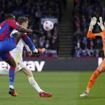 
              Crystal Palace's Jean-Philippe Mateta, left, tries to kick the ball over Leeds United goalkeeper Illan Meslier during the English Premier League soccer match between Crystal Palace and Leeds United at Selhurst Park, London, Monday April 25, 2022. (John Walton/PA via AP)
            