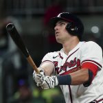 
              Atlanta Braves' Austin Riley watches a solo home run during the fifth inning of the team's baseball game against the Miami Marlins on Saturday, April 23, 2022, in Atlanta. (AP Photo/John Bazemore)
            