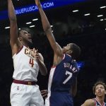 
              Cleveland Cavaliers center Evan Mobley (4) shoots over Brooklyn Nets forward Kevin Durant (7) during the second half of an NBA basketball game, Friday April 8, 2022, in New York. (AP Photo/Bebeto Matthews)
            