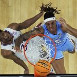 
              North Carolina forward Armando Bacot shoots over Kansas forward David McCormack during the second half of a college basketball game in the finals of the Men's Final Four NCAA tournament, Monday, April 4, 2022, in New Orleans. (AP Photo/David J. Phillip)
            