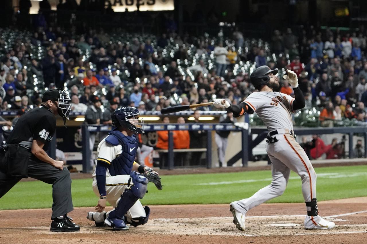 San Francisco Giants' Luis Gonzalez hits a two-run home run during the ninth inning of a baseball g...