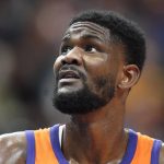 
              Phoenix Suns center Deandre Ayton looks at the scoreboard during the first half of the team's NBA basketball game against the Utah Jazz on Friday, April 8, 2022, in Salt Lake City. (AP Photo/Rick Bowmer)
            