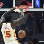 
              Atlanta Hawks' Clint Capela dunks during the first half of the team's NBA play-in basketball game against the Cleveland Cavaliers Friday, April 15, 2022, in Cleveland. (AP Photo/Nick Cammett)
            