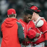 
              Cincinnati Reds starting pitcher Reiver Sanmartin (52) leaves the field after being relieved in the third inning of a baseball game against the Atlanta Braves Friday, April 8, 2022, in Atlanta. (AP Photo/John Bazemore)
            