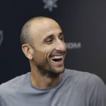 
              FILE - Former San Antonio Spurs guard Manu Ginobili jokes with the media at the NBA basketball team's practice facility, Saturday, Sept. 15, 2018, in San Antonio. NBA stars Manu Ginobili and Tim Hardaway are among five new  Basketball Hall of Fame inductees. Also selected this year were WNBA great Swin Cash, former NBA coach George Karl and long-time college coach Bob Huggins. They will be enshrined into the Naismith Memorial Basketball Hall of Fame in Springfield, Massachusetts, on Sept. 10, 2022   (AP Photo/Eric Gay, File)
            