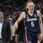 
              UConn's Paige Bueckers reacts as she heads to the bench during the second half of a college basketball game in the semifinal round of the Women's Final Four NCAA tournament Friday, April 1, 2022, in Minneapolis. (AP Photo/Eric Gay)
            