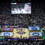 
              The National anthem is performed prior to a college basketball game in the semifinal round of the Men's Final Four NCAA tournament, Saturday, April 2, 2022, in New Orleans. (AP Photo/David J. Phillip)
            