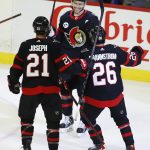
              Ottawa Senators defenseman Artem Zub (2) celebrates after his goal against the Detroit Red Wings with teammates Mathieu Joseph (21) and Erik Brannstrom (26) during first-period NHL hockey game action in Ottawa, Ontario, Sunday, April 3, 2022. (Patrick Doyle/The Canadian Press via AP)
            