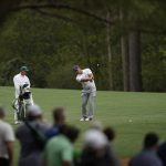 
              Bryson DeChambeau hits from the fairway on the 11th hole during a practice round for the Masters golf tournament on Wednesday, April 6, 2022, in Augusta, Ga. (AP Photo/Matt Slocum)
            
