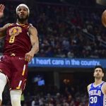 
              Cleveland Cavaliers forward Lamar Stevens (8) reacts after a dunk in the first half of an NBA basketball game against the Philadelphia 76ers, Sunday, April 3, 2022, in Cleveland. (AP Photo/David Dermer)
            