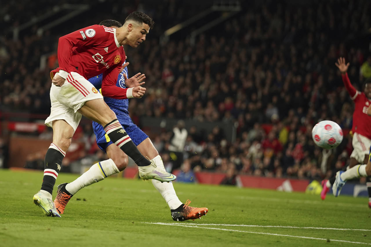Manchester United's Cristiano Ronaldo scores his side's first goal during the English Premier Leagu...
