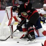 
              Ottawa Senators center Mark Kastelic (47) tries to control the puck in front of the net of Florida Panthers goaltender Spencer Knight (30) during the second period of an NHL hockey game Thursday, April 28, 2022, in Ottawa, Ontario. (Justin Tang/The Canadian Press via AP)
            