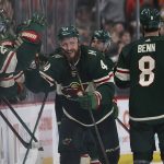 Minnesota Wild left wing Nicolas Deslauriers (44) high fives teammates on the bench after scoring a goal against the Seattle Kraken during the second period of an NHL hockey game, Friday, April 22, 2022, in St. Paul, Minn. (AP Photo/Stacy Bengs)