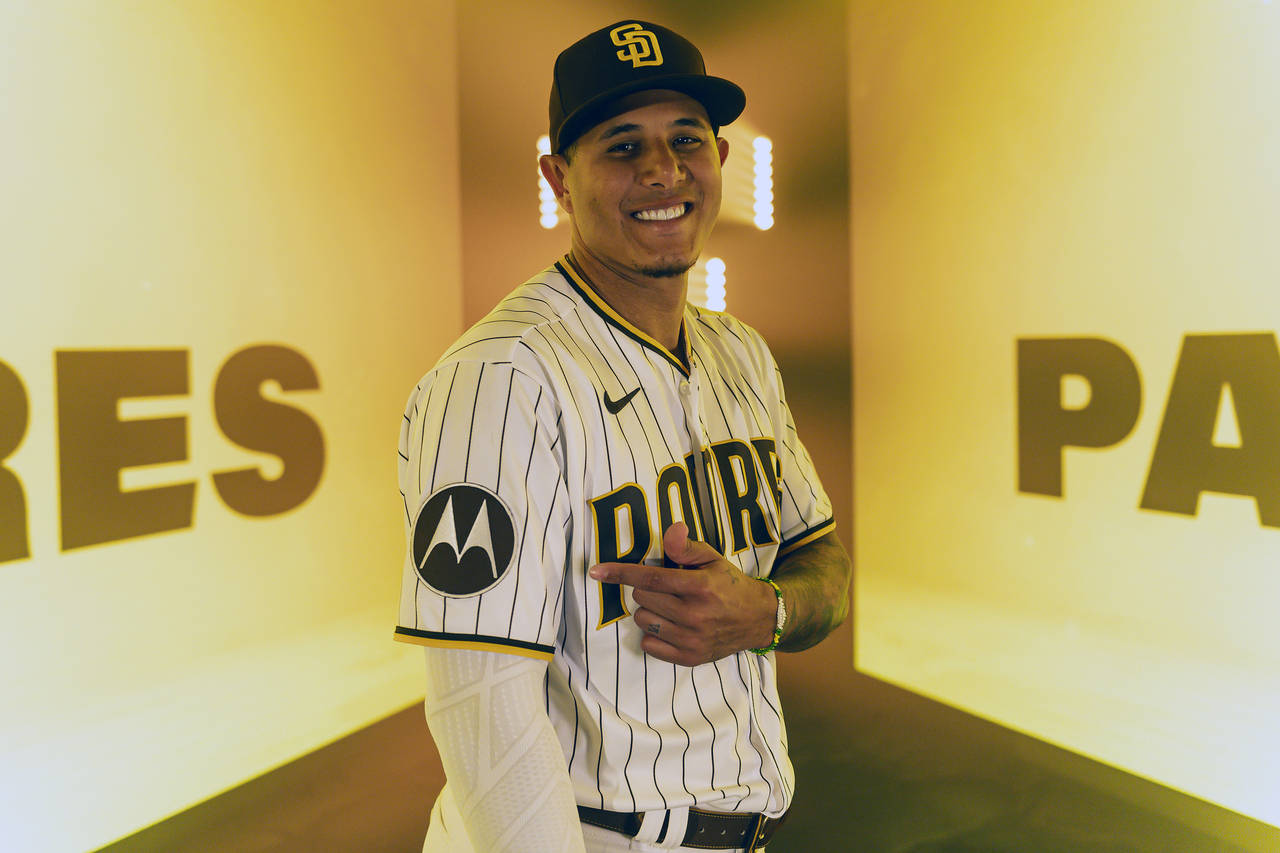 This photo provided by the San Diego Padres shows Padres third baseman Manny Machado gesturing towa...