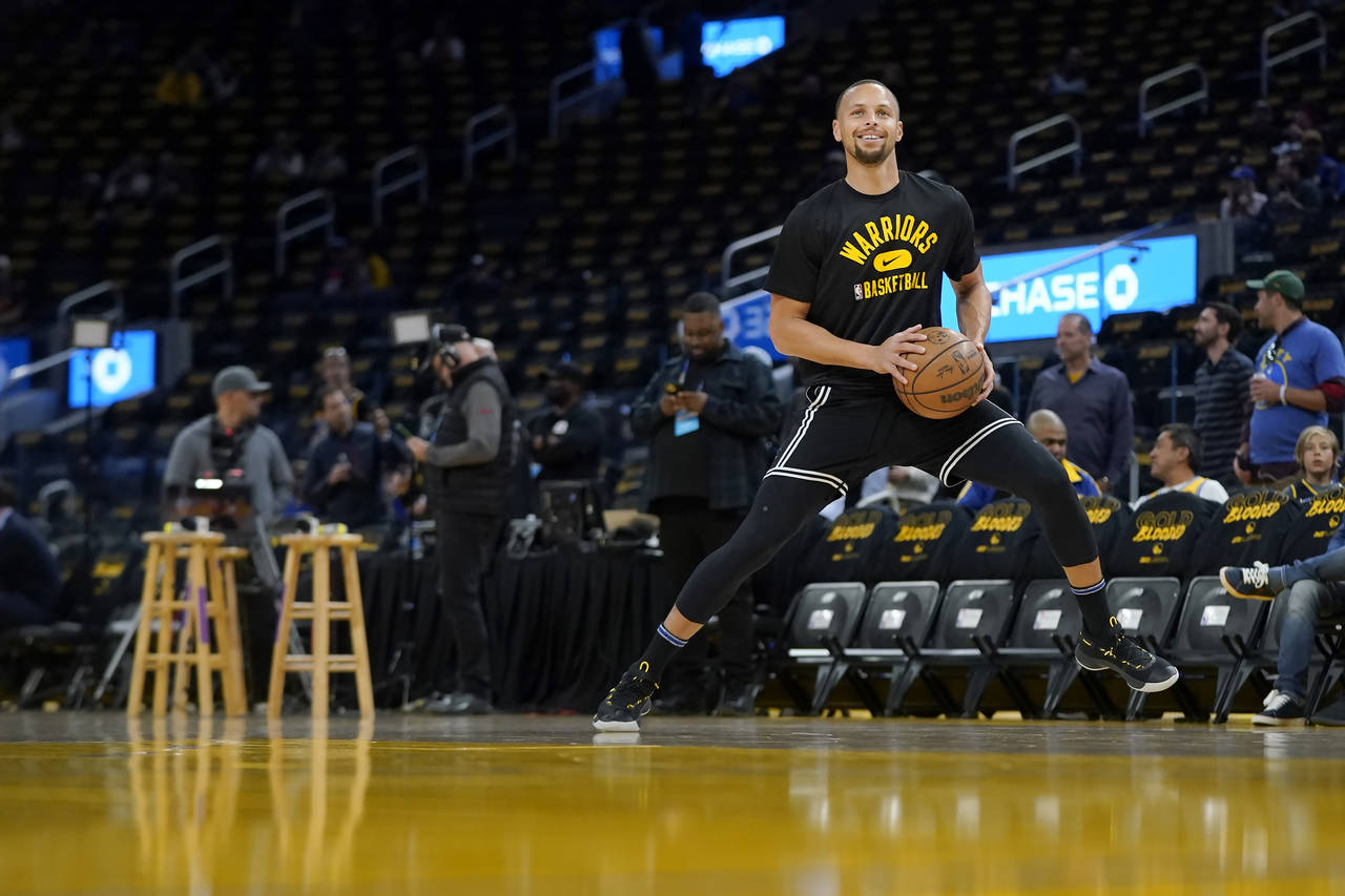 Golden State Warriors guard Stephen Curry warms up before Game 1 of the team's NBA basketball first...