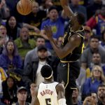 
              Golden State Warriors forward Draymond Green dunks over Denver Nuggets forward Will Barton (5) during the first half of Game 5 of an NBA basketball first-round playoff series in San Francisco, Wednesday, April 27, 2022. (AP Photo/Jed Jacobsohn)
            