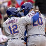 
              New York Mets' Pete Alonso (20) celebrates with Francisco Lindor (12) after hitting a three-run home run during the sixth inning of a baseball game against the Philadelphia Phillies, Wednesday, April 13, 2022, in Philadelphia. (AP Photo/Laurence Kesterson)
            