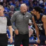
              Referee Tyler Ford, left, stands by as Dallas Mavericks head coach Jason Kidd, center, talks with guard Spencer Dinwiddie (26) in the second half of Game 1 of an NBA basketball first-round playoff series against the Utah Jazz, Saturday, April 16, 2022, in Dallas. (AP Photo/Tony Gutierrez)
            
