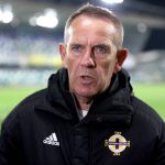 
              Northern Ireland manager Kenny Shiels speaks during a post match interview after the Women's World Cup Qualifying match between Northern Ireland and England, at Windsor Park, Belfast, Northern Ireland, Tuesday April 12, 2022. The coach of Northern Ireland’s women’s team has provoked criticism by saying girls and women were more susceptible to conceding multiple goals in a short space of time because they are “more emotional than men.”  (Liam McBurney/PA via AP)
            