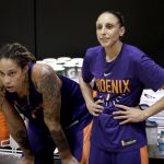 
              FILE - Phoenix Mercury's Brittney Griner, left, watches practice with teammate Diana Taurasi on Thursday, May 10, 2018, in Phoenix. Since arriving a Moscow airport in mid-February, Griner has been detained by police after they reported finding vape cartridges allegedly containing cannabis oil in her luggage. Still in jail, she is awaiting trial next month on charges that could bring up to 10 years in prison. Taurasi also spent years playing in Russia for UMKC Ekaterinburg owner Shabtai Kalmanovich, and spoke of luxurious living conditions and the lavish trips he would provide. (AP Photo/Matt York, File)
            