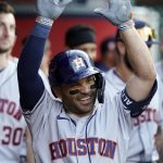 
              Houston Astros' Jose Altuve celebrates in the dugout after his solo home run during the first inning of the team's baseball game against the Los Angeles Angels on Friday, April 8, 2022, in Anaheim, Calif. (AP Photo/Marcio Jose Sanchez)
            