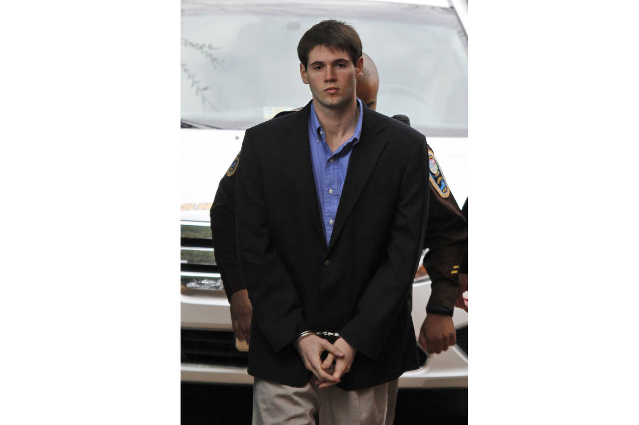 FILE - George Huguely is escorted into the Charlottesville Circuit courthouse in Charlottesville, V...