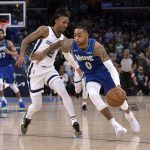 
              Minnesota Timberwolves guard D'Angelo Russell (0) drives against Memphis Grizzlies guard Ja Morant (12) during the second half during Game 1 of a first-round NBA basketball playoff series Saturday, April 16, 2022, in Memphis, Tenn. (AP Photo/Brandon Dill)
            