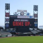 
              The San Francisco Giants new advertising campaign, Game Up, is displayed on the center field scoreboard during the annual media open house at Oracle Park, Friday, April 1, 2022, in San Francisco. The Giants' Opening Day baseball game is next Friday against the Miami Marlins. (AP Photo/Eric Risberg)
            