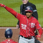 
              Washington Nationals' Juan Soto (22) celebrates as he returns to the dugout after hitting a solo home run off Pittsburgh Pirates starting pitcher Bryse Wilson during the fifth inning of a baseball game in Pittsburgh, Saturday, April 16, 2022. (AP Photo/Gene J. Puskar)
            