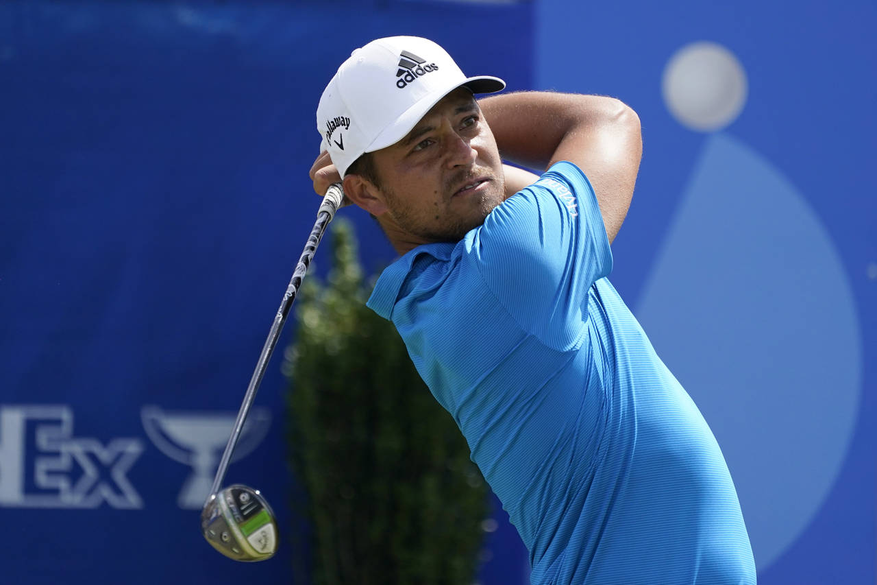 Xander Schauffele hits off the first tee during the second round of the PGA Zurich Classic golf tou...